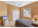 Guest bedroom featuring neutral walls, closet, ceiling fan, and minimal furnishings at 446 Pinewood Lake Dr, Venice, FL 34285