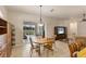 Open dining area with natural lighting and access to the lanai at 446 Pinewood Lake Dr, Venice, FL 34285