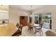 Bright dining area adjacent to the kitchen with views of the golf course at 446 Pinewood Lake Dr, Venice, FL 34285