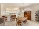 Open concept dining room and kitchen area features bright light and airy space at 446 Pinewood Lake Dr, Venice, FL 34285