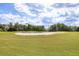 Beautifully maintained golf course with a large sand bunker and manicured green at 446 Pinewood Lake Dr, Venice, FL 34285