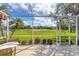Enjoy outdoor living on this screened lanai with a lovely golf course view at 446 Pinewood Lake Dr, Venice, FL 34285