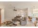 Inviting living room with an open layout, seamlessly connected to the kitchen and dining area at 446 Pinewood Lake Dr, Venice, FL 34285