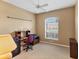 Office space with a desk, chair, and a large window at 446 Pinewood Lake Dr, Venice, FL 34285