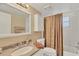 Bright bathroom featuring a shower-tub combo and a large vanity at 454 Cerromar Rd # 172, Venice, FL 34293