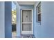 Front entrance of the condo with a storm door and welcome mat at 454 Cerromar Rd # 172, Venice, FL 34293