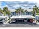 Exterior view of the condo with carport parking and well-manicured landscaping at 454 Cerromar Rd # 172, Venice, FL 34293