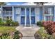 Two-story condo featuring white stairs and shuttered windows at 454 Cerromar Rd # 172, Venice, FL 34293