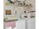 Functional laundry room with washer and dryer units, and storage shelves at 454 Cerromar Rd # 172, Venice, FL 34293