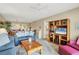 Inviting living room featuring comfortable seating and a modern entertainment center at 454 Cerromar Rd # 172, Venice, FL 34293