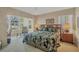 Bright and airy main bedroom featuring a large window with lush views at 454 Cerromar Rd # 172, Venice, FL 34293