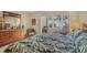 Comfortable main bedroom featuring a cozy seating area and natural light at 454 Cerromar Rd # 172, Venice, FL 34293