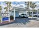 Assigned carport parking near the unit with mailbox and storage shed at 454 Cerromar Rd # 172, Venice, FL 34293