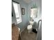 Bathroom with toilet, granite counter and a window allowing natural light at 473 Sharks Pt, North Port, FL 34287
