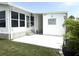Charming home with a welcoming entrance and bright patio, complemented by lush landscaping and an inviting entryway at 473 Sharks Pt, North Port, FL 34287