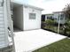 Bright, well-maintained patio area, perfect for outdoor relaxation and entertaining with neatly landscaped yard at 473 Sharks Pt, North Port, FL 34287