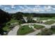 Scenic aerial view captures a charming community with verdant landscapes, and inviting public spaces at 5051 Greenway Dr, North Port, FL 34287