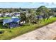 Beautifully landscaped property with a screened-in pool and expansive yard leading to waterfront at 5051 Greenway Dr, North Port, FL 34287