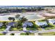 Aerial view of homes close to a lake, highlighting neighborhood's tranquil setting at 5051 Greenway Dr, North Port, FL 34287