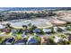 Neighborhood aerial view of homes near a lake, showcasing a serene environment at 5051 Greenway Dr, North Port, FL 34287