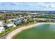 Aerial view featuring waterfront homes with lush landscaping and neighborhood streets at 5051 Greenway Dr, North Port, FL 34287