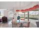 Cozy breakfast nook adjacent to pool with wicker furniture and abundant light at 5051 Greenway Dr, North Port, FL 34287