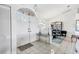 Bright foyer featuring tile floors and a dining area at 5051 Greenway Dr, North Port, FL 34287