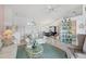 Open-concept living area features a large window, tile floors, and access to the dining area at 5051 Greenway Dr, North Port, FL 34287