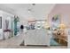 Bright living room with neutral tones, large windows, and tile flooring at 5051 Greenway Dr, North Port, FL 34287