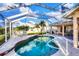 Inviting screened-in pool with patio and seating areas perfect for enjoying the sun at 5051 Greenway Dr, North Port, FL 34287