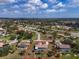 Property view showcasing pool, tropical trees, and landscaping at 5061 Richmond Ter, North Port, FL 34287