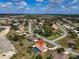 Aerial property view including pool, tropical trees, and landscaping at 5061 Richmond Ter, North Port, FL 34287