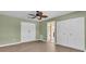 Neutral bedroom with new hardwood flooring, ceiling fan and spacious closets at 5061 Richmond Ter, North Port, FL 34287