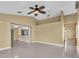 Bright and airy living room with tile floors, vaulted ceiling, and a ceiling fan at 5061 Richmond Ter, North Port, FL 34287