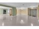 Spacious living area with tile flooring, neutral walls, and seamless flow to other rooms at 5061 Richmond Ter, North Port, FL 34287