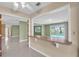 Open-concept living room with views of the outdoor pool and backyard at 5061 Richmond Ter, North Port, FL 34287