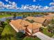 Aerial view of home near golf course and lake at 5151 Pine Shadow Ln, North Port, FL 34287