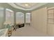 Well-lit bedroom featuring built-in wardrobe cabinets and sunlit windows at 5151 Pine Shadow Ln, North Port, FL 34287
