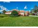 Charming single-story home exterior with an attached two car garage at 5151 Pine Shadow Ln, North Port, FL 34287