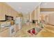 Well-equipped kitchen features granite countertops, modern appliances, and ample cabinet space at 5151 Pine Shadow Ln, North Port, FL 34287