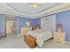 This main bedroom has a charming decor and access to an en suite bathroom at 5151 Pine Shadow Ln, North Port, FL 34287