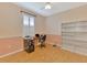 Home office with modern ceiling fan, window with blind, desk, and storage bookshelf at 5151 Pine Shadow Ln, North Port, FL 34287