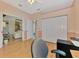 Home office boasts wood floors, ample natural light, and additional closet storage at 5151 Pine Shadow Ln, North Port, FL 34287