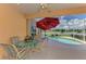 Beautiful pool with a tranquil water view and patio, perfect for outdoor relaxation at 5151 Pine Shadow Ln, North Port, FL 34287