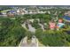 Aerial view of the community showcasing lush landscaping, winding roads, and a variety of home styles at 560 Misty Pine Dr, Venice, FL 34292