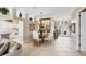 Charming dining area features a glass-top table with seating for four, complemented by stylish decor at 560 Misty Pine Dr, Venice, FL 34292