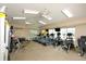 Bright fitness center with treadmills, weight machines, televisions, and ceiling fans at 560 Misty Pine Dr, Venice, FL 34292