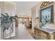 Elegant foyer with stone floors, tray ceilings and furniture at 560 Misty Pine Dr, Venice, FL 34292