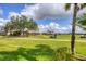 Scenic golf course view showcasing manicured greens and community landscaping at 560 Misty Pine Dr, Venice, FL 34292