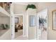 Hallway showcasing an open floorplan with multiple doorways and natural light at 560 Misty Pine Dr, Venice, FL 34292